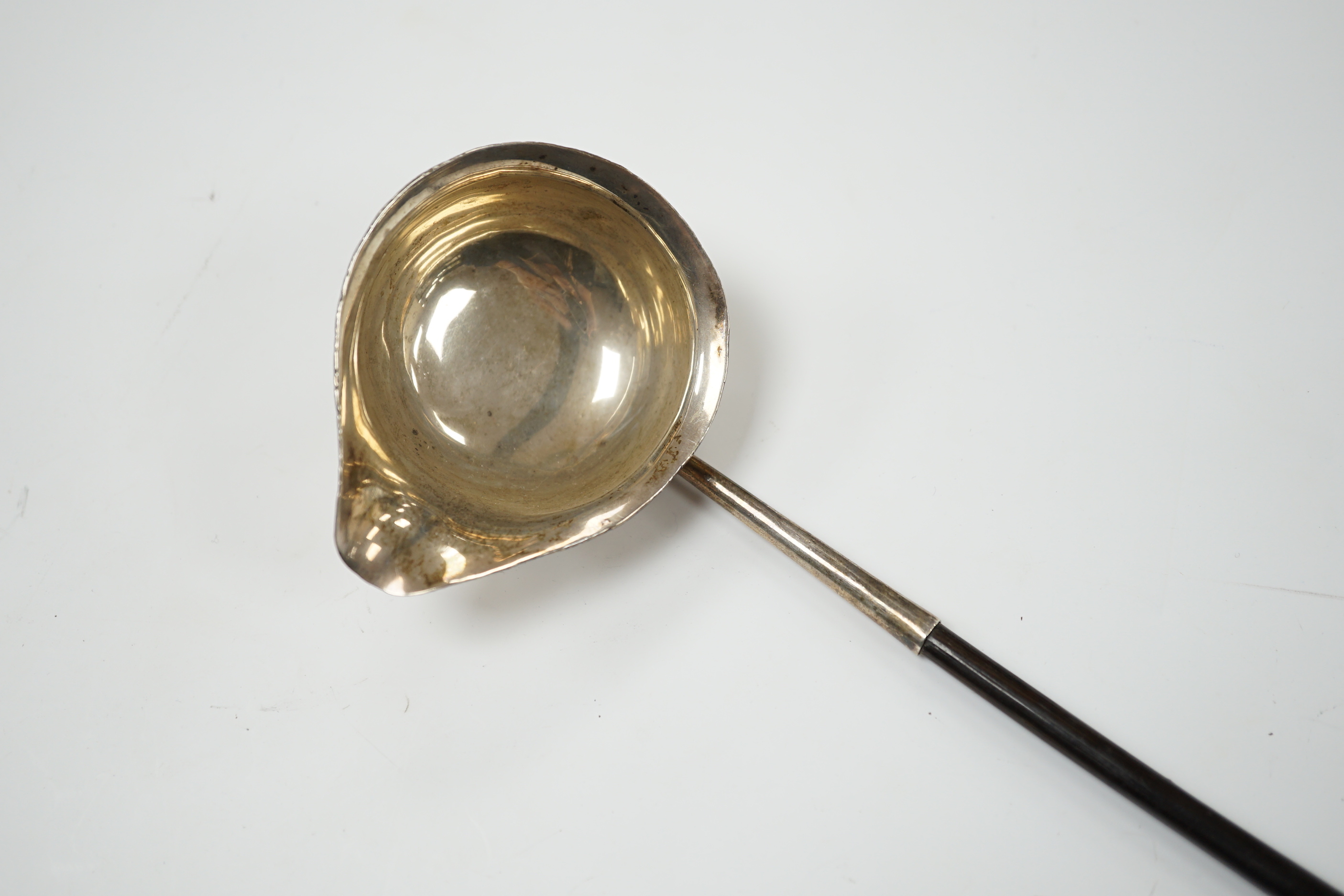 A George III silver toddy ladle with baleen handle and crested bowl, 34.5cm, unmarked